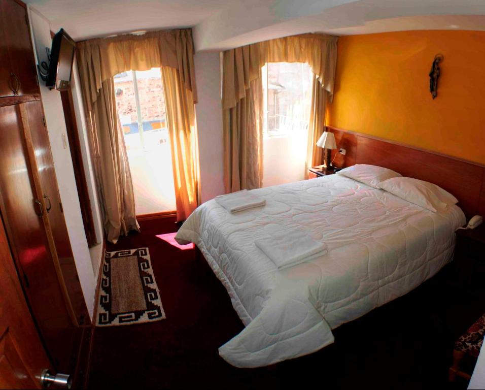 Postel nebo postele na pokoji v ubytování Kaaro Hotel El Buho