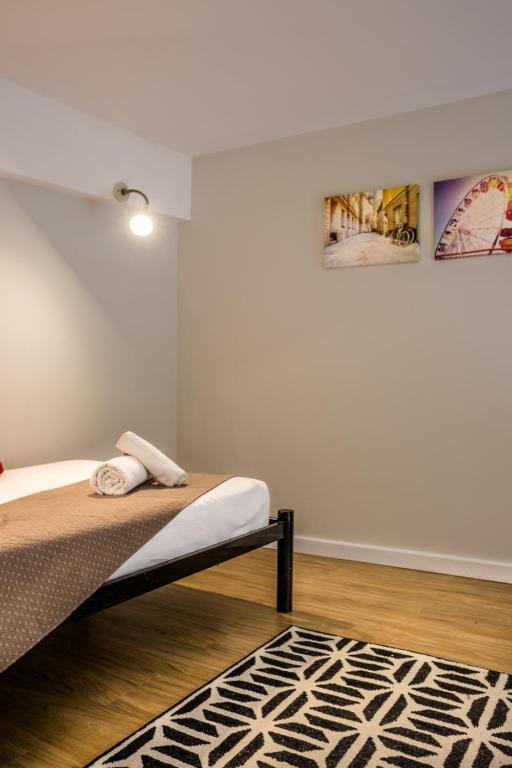 Cama ou camas em um quarto em Injoy Lofts & Studios Ipanema