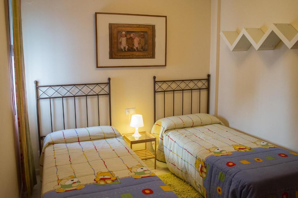 Posteľ alebo postele v izbe v ubytovaní Apartamento Torcal Écija