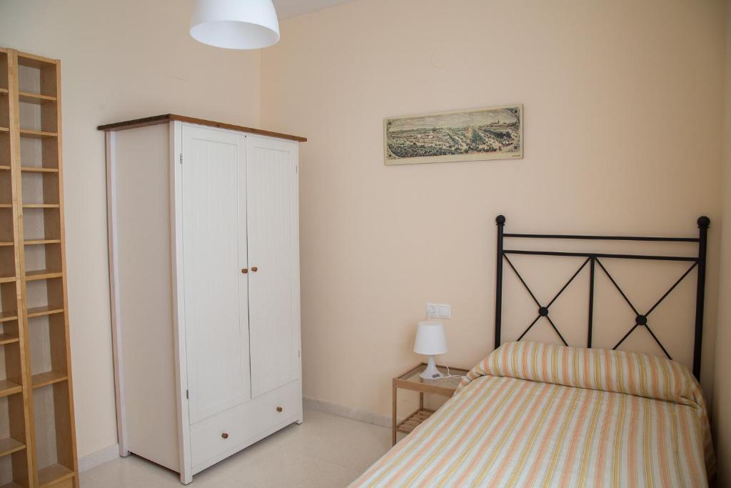 Posteľ alebo postele v izbe v ubytovaní Apartamento Torcal Écija