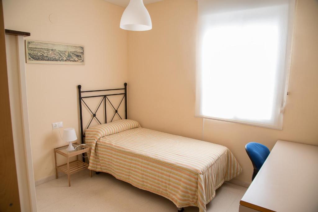 Posteľ alebo postele v izbe v ubytovaní Apartamento Torcal Écija