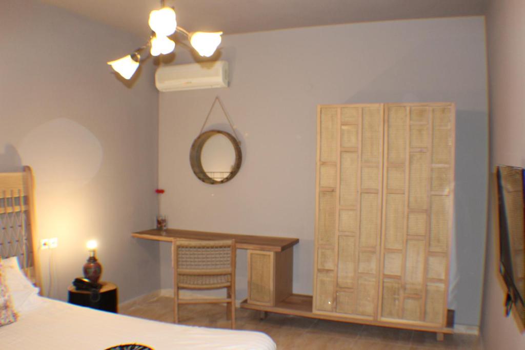 Postel nebo postele na pokoji v ubytování Kelyfos Hotel
