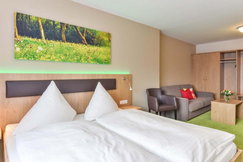 Postel nebo postele na pokoji v ubytování Hotel Sixt