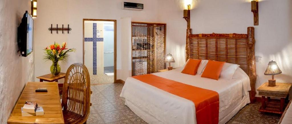 Postel nebo postele na pokoji v ubytování Hotel Punta Faro