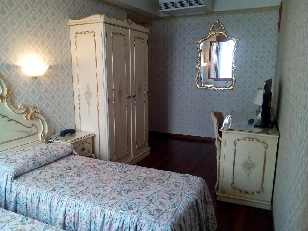 Postel nebo postele na pokoji v ubytování Hotel Diana