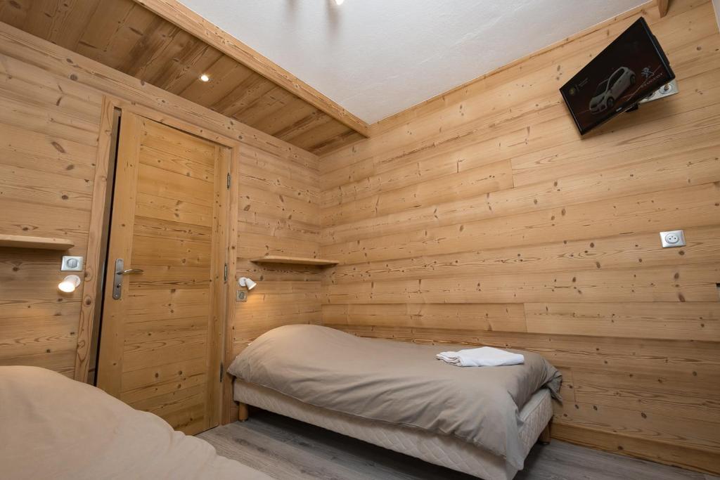 Postel nebo postele na pokoji v ubytování Hôtel Flor'Alpes