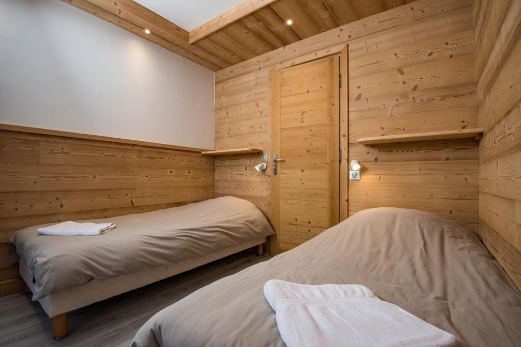 Postel nebo postele na pokoji v ubytování Hôtel Flor'Alpes
