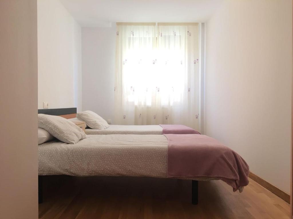 Posteľ alebo postele v izbe v ubytovaní Alojamiento moderno y céntrico