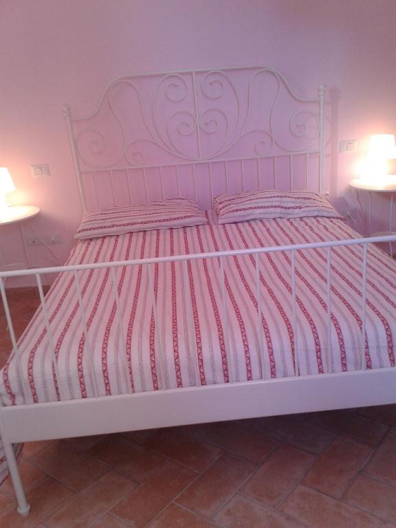 Postel nebo postele na pokoji v ubytování Agriturismo campagna in compagnia