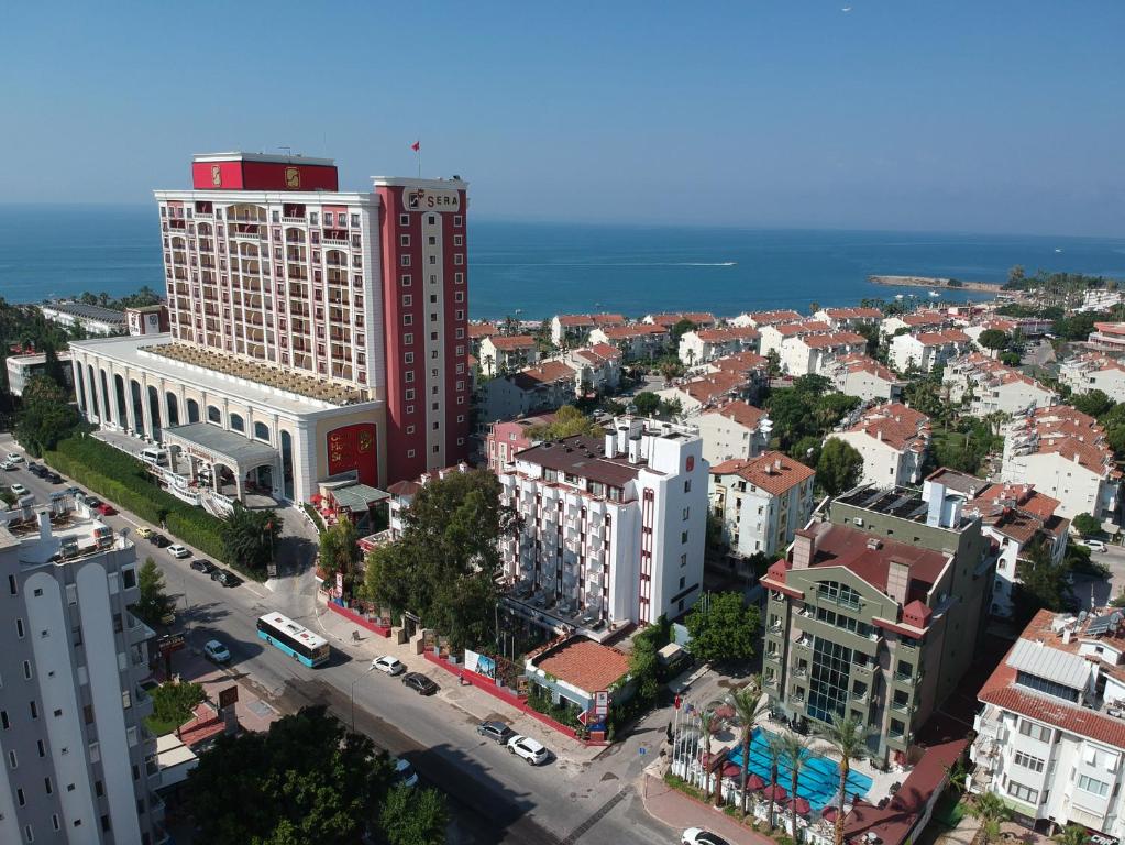 an aerial view of a city with a tall building at Lara Park Hotel in Antalya