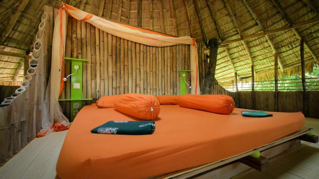 Postel nebo postele na pokoji v ubytování Bukit Raya Guesthouse