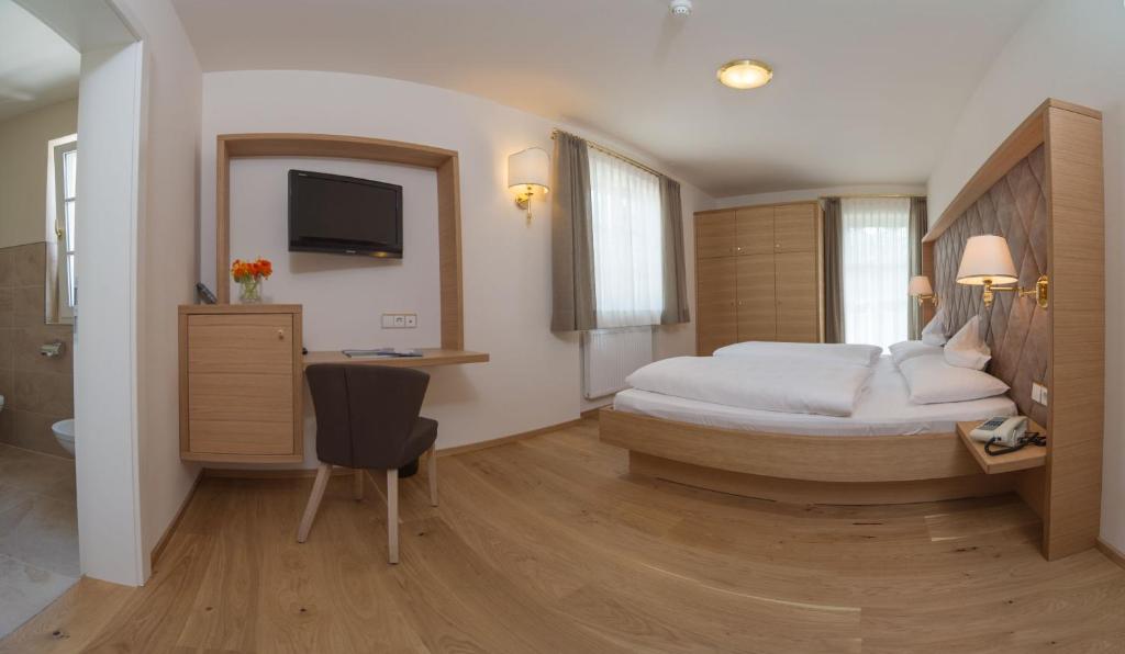 Łóżko lub łóżka w pokoju w obiekcie Park Hotel Bellevue