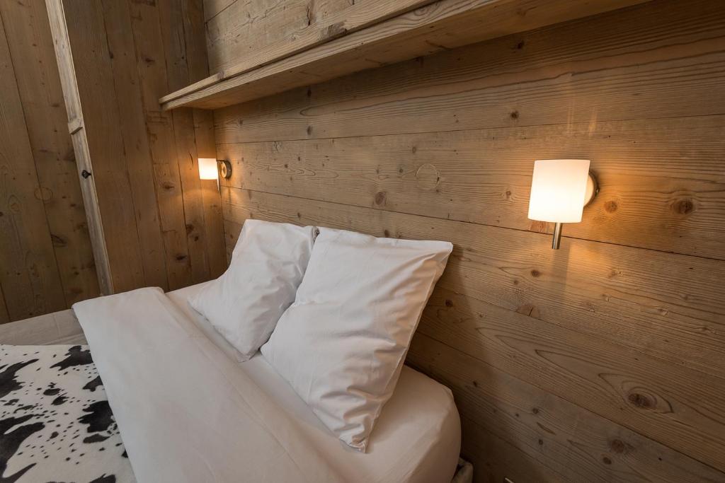 Postel nebo postele na pokoji v ubytování Hôtel Flor'Alpes