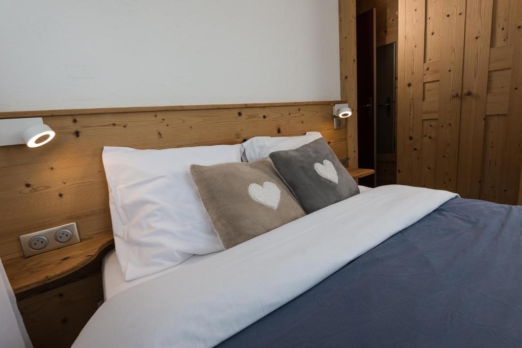 Postel nebo postele na pokoji v ubytování Hôtel Flor'Alpes