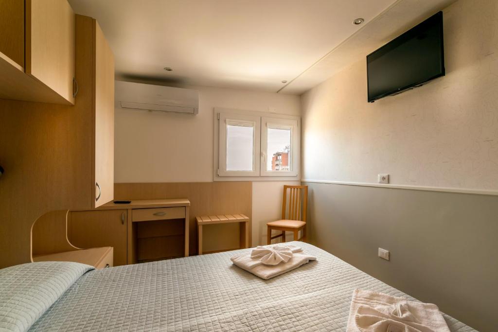 Postel nebo postele na pokoji v ubytování Hotel Stresa