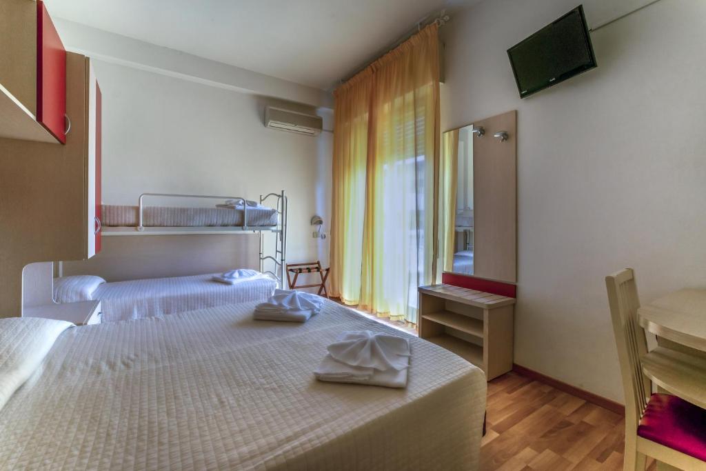 Postel nebo postele na pokoji v ubytování Hotel Stresa