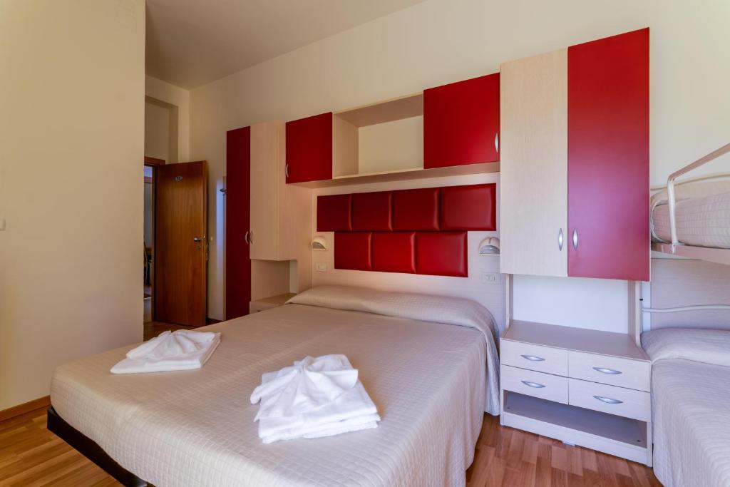 Postel nebo postele na pokoji v ubytování Hotel Stresa