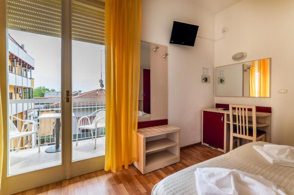 Postel nebo postele na pokoji v ubytování Hotel Stresa