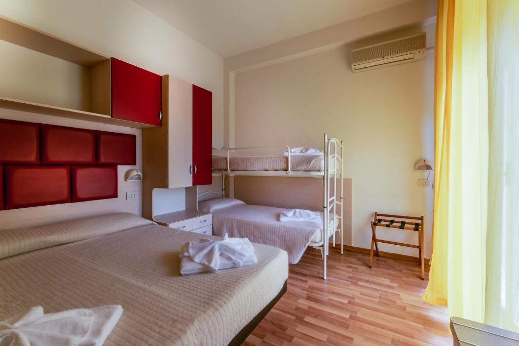Postel nebo postele na pokoji v ubytování Hotel Stresa