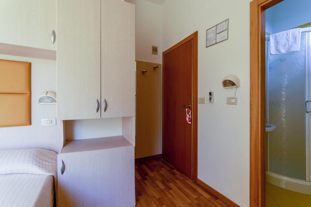 Postel nebo postele na pokoji v ubytování Hotel Stresa