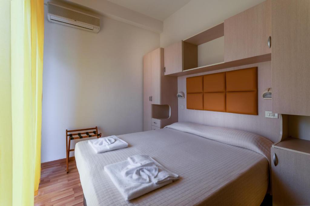 Postel nebo postele na pokoji v ubytování Hotel Stresa
