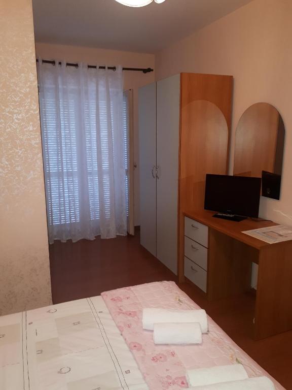 Postel nebo postele na pokoji v ubytování Apartments Tutina