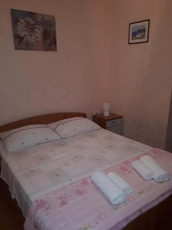 Postel nebo postele na pokoji v ubytování Apartments Tutina