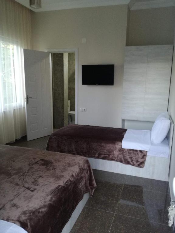 Postel nebo postele na pokoji v ubytování Guest House Sofia