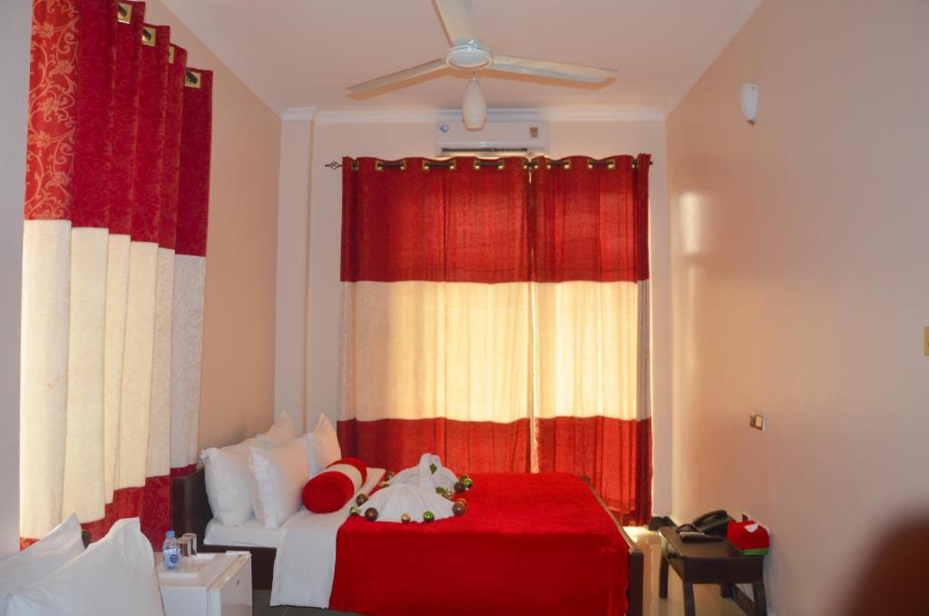 Postel nebo postele na pokoji v ubytování Dreams Hotel Zanzibar