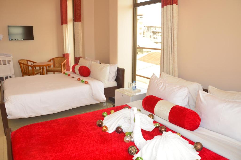 Postel nebo postele na pokoji v ubytování Dreams Hotel Zanzibar