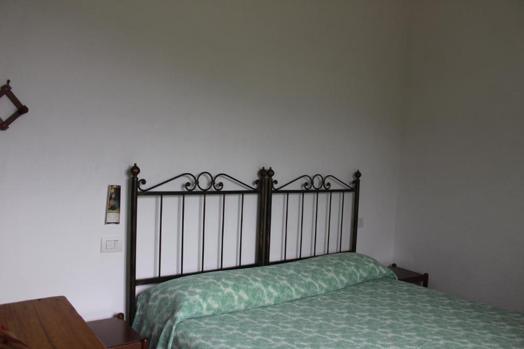 Postel nebo postele na pokoji v ubytování Il Castello sul Lago