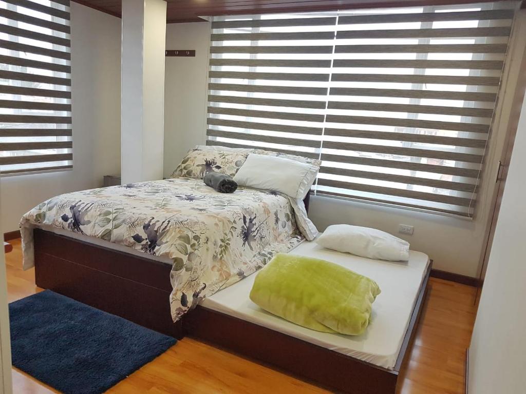 Postel nebo postele na pokoji v ubytování Hotel Casa Huesped Kiwi