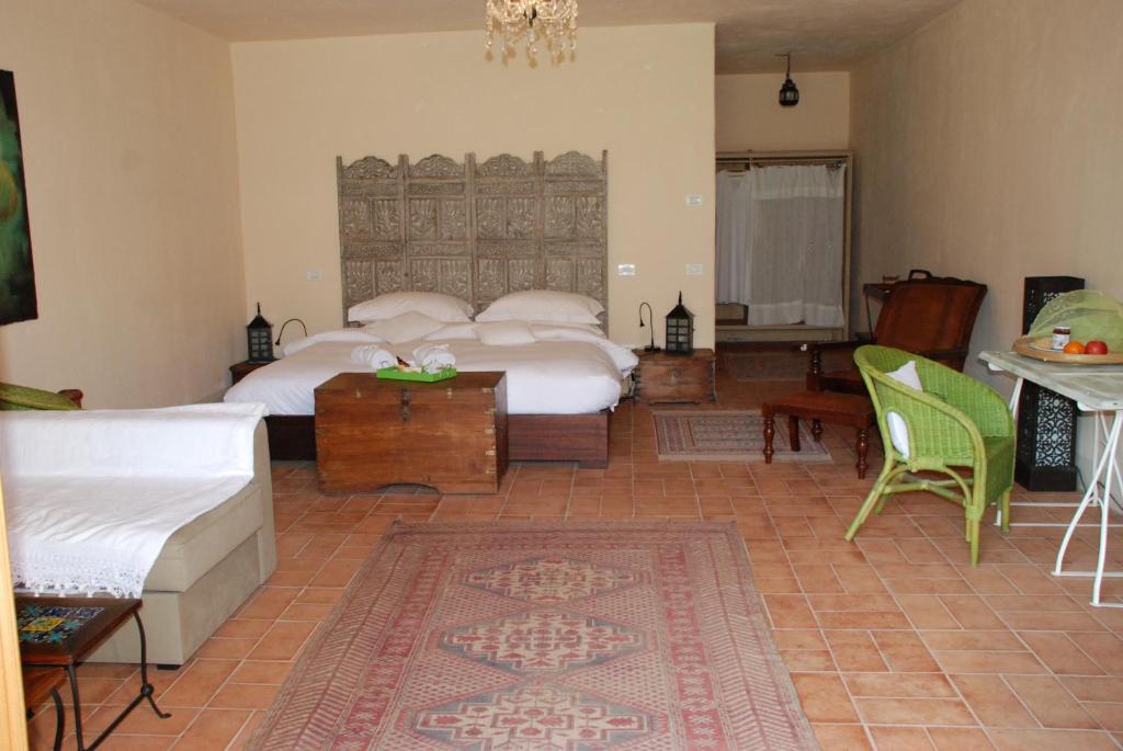 Postel nebo postele na pokoji v ubytování Hotel Podere Conti