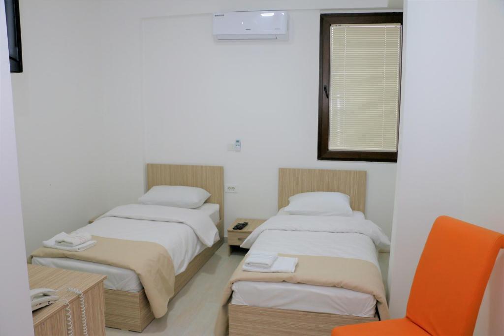 Postel nebo postele na pokoji v ubytování Hotel Old Konak