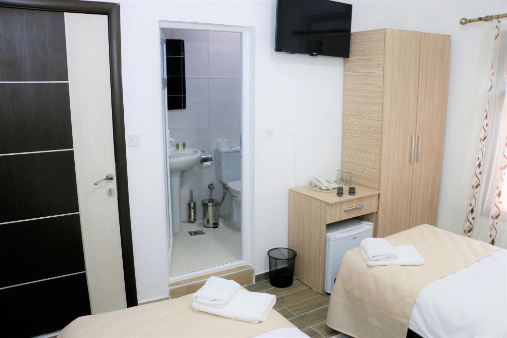 Postel nebo postele na pokoji v ubytování Hotel Old Konak
