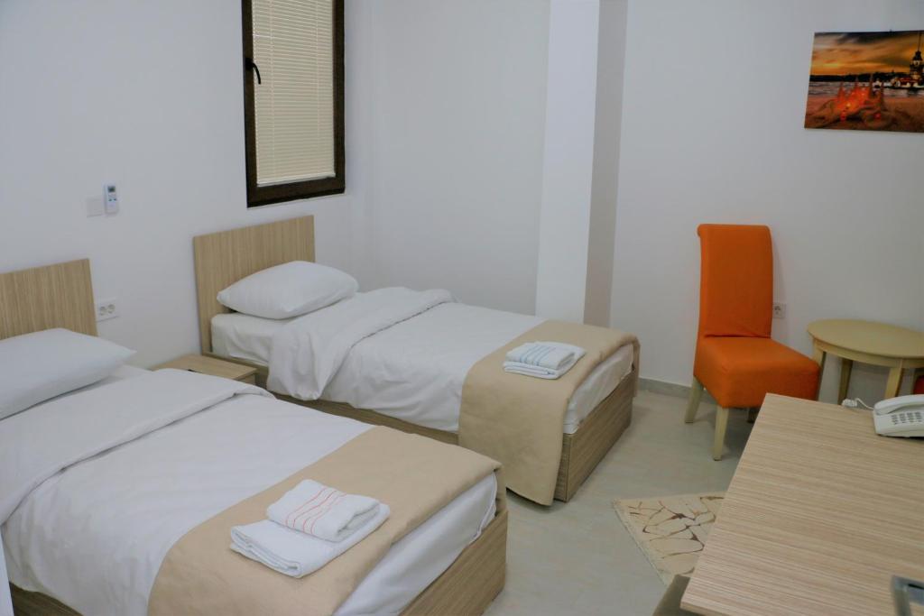 Postel nebo postele na pokoji v ubytování Hotel Old Konak