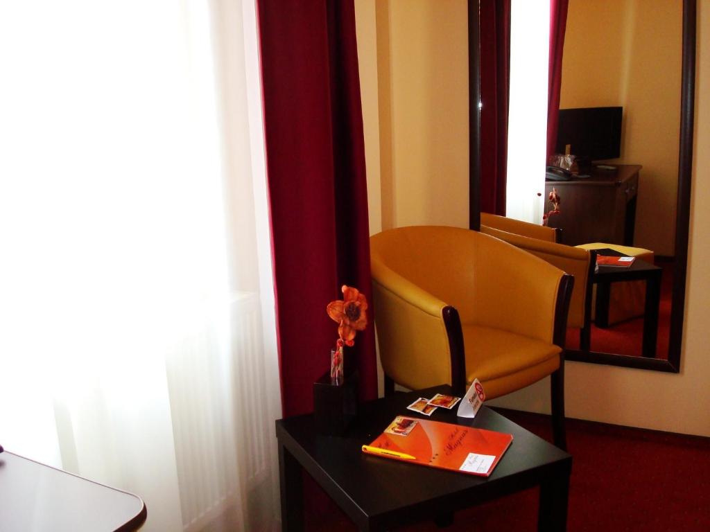 TV a/nebo společenská místnost v ubytování Hotel Magnus Galati