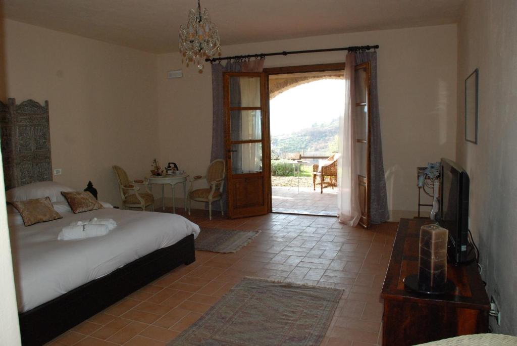 Postel nebo postele na pokoji v ubytování Hotel Podere Conti