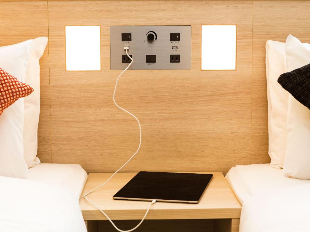 Postel nebo postele na pokoji v ubytování Hotel JAL City Haneda Tokyo West Wing
