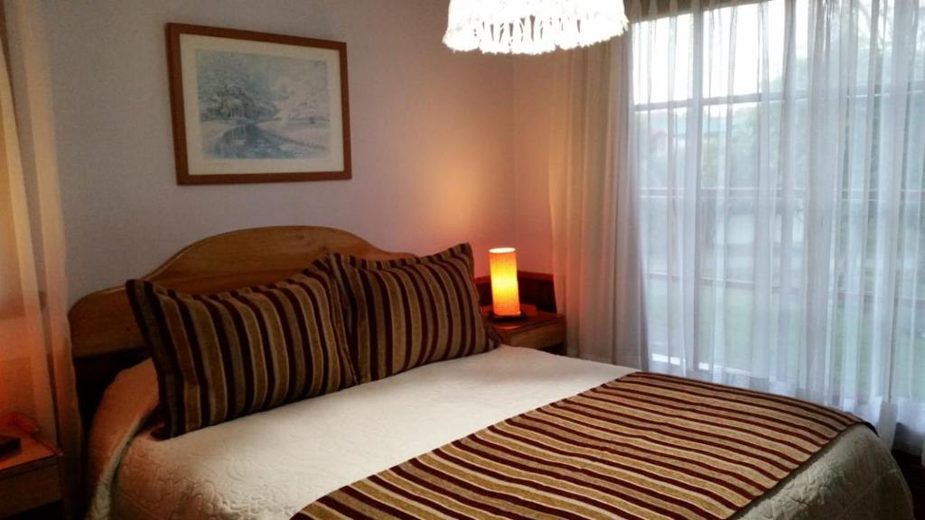 Postel nebo postele na pokoji v ubytování Hotel y Cabañas Molino Viejo