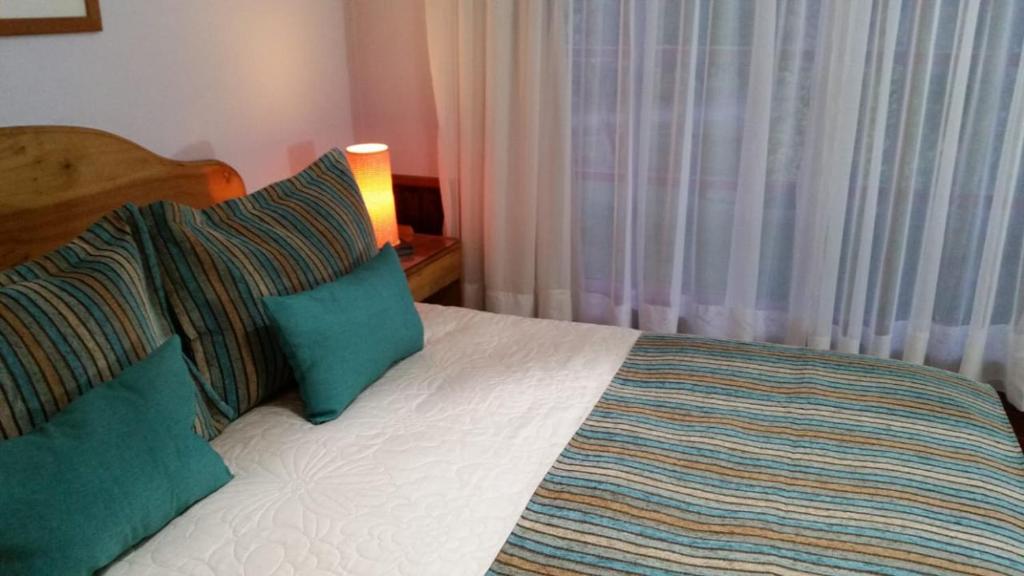 Postel nebo postele na pokoji v ubytování Hotel y Cabañas Molino Viejo