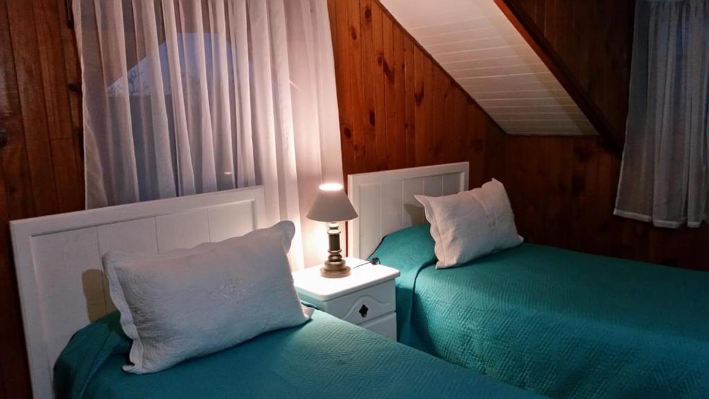Postel nebo postele na pokoji v ubytování Hotel y Cabañas Molino Viejo
