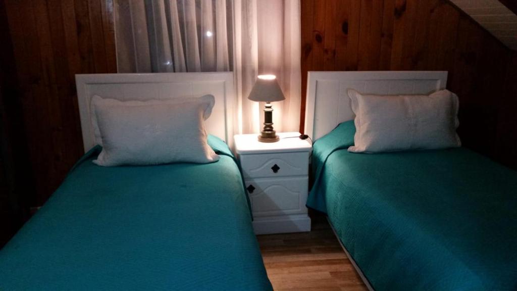 Postel nebo postele na pokoji v ubytování Hotel y Cabañas Molino Viejo