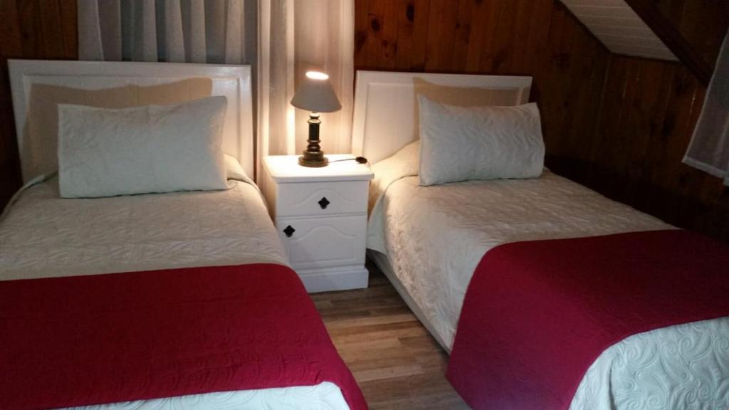 Postel nebo postele na pokoji v ubytování Hotel y Cabañas Molino Viejo