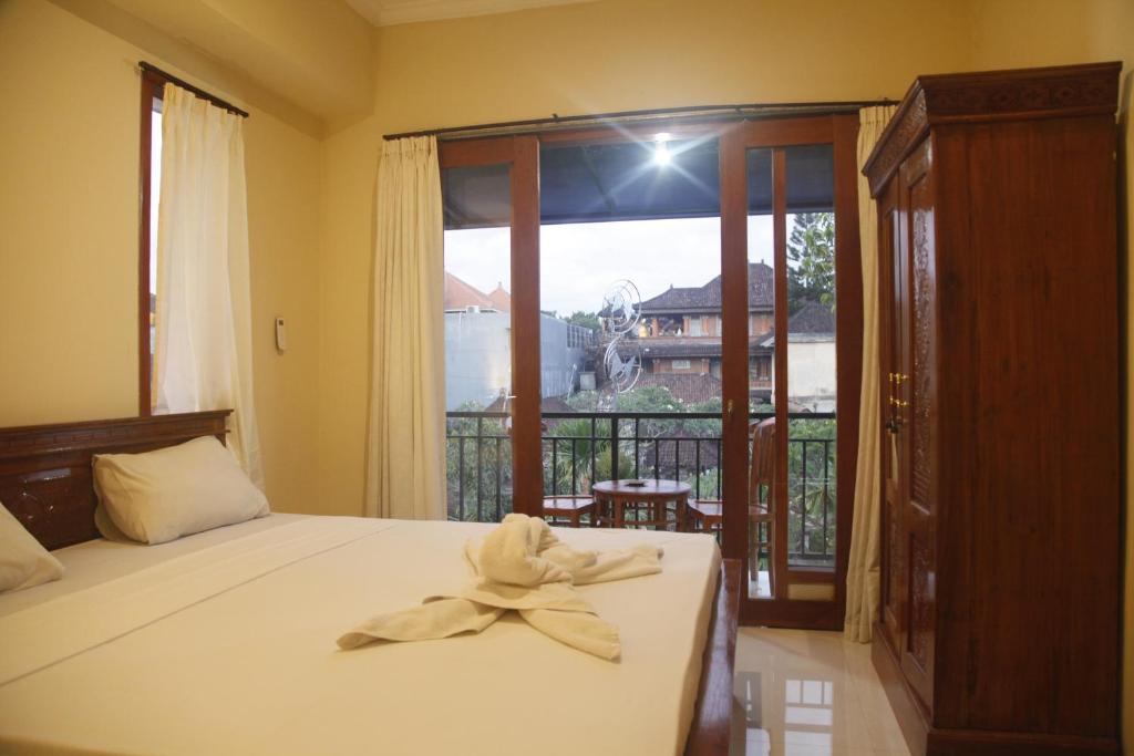 Postel nebo postele na pokoji v ubytování Baruna Guest House