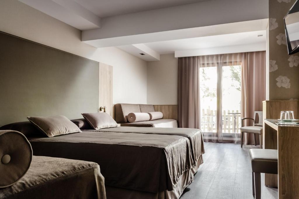 Postel nebo postele na pokoji v ubytování Hotel Civera
