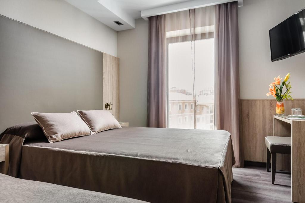 Postel nebo postele na pokoji v ubytování Hotel Civera