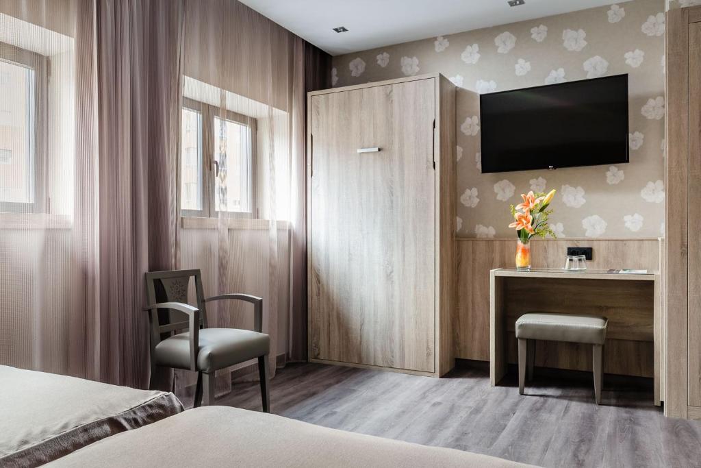 Postel nebo postele na pokoji v ubytování Hotel Civera