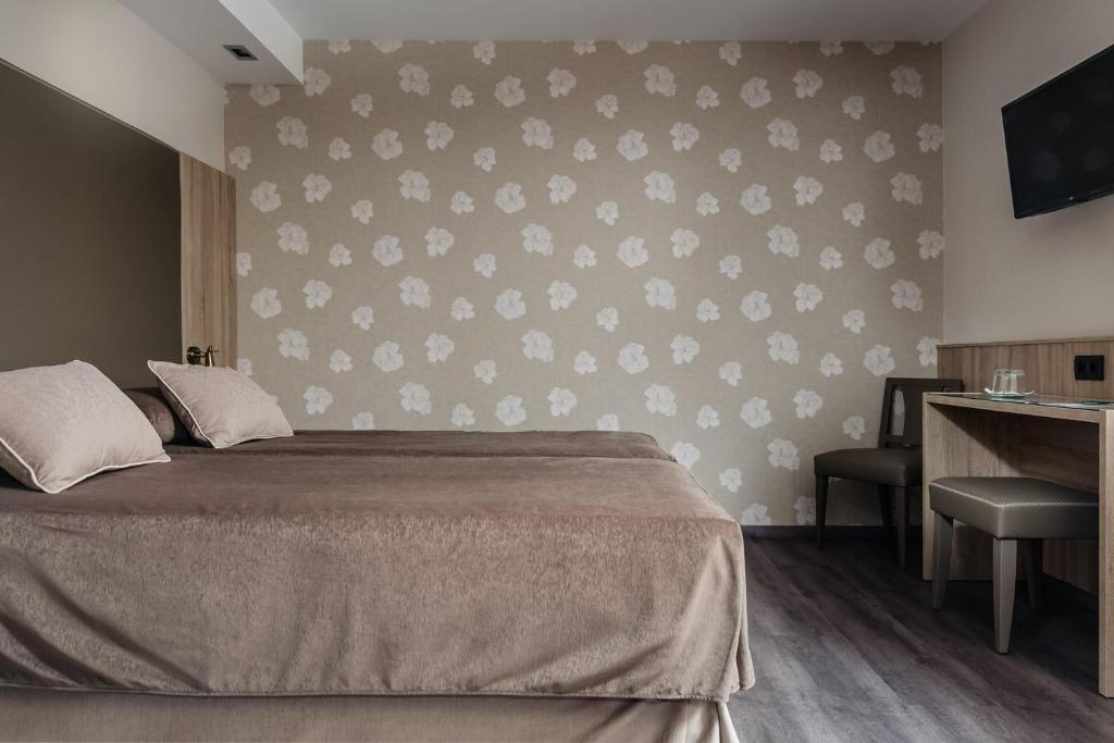 Postel nebo postele na pokoji v ubytování Hotel Civera