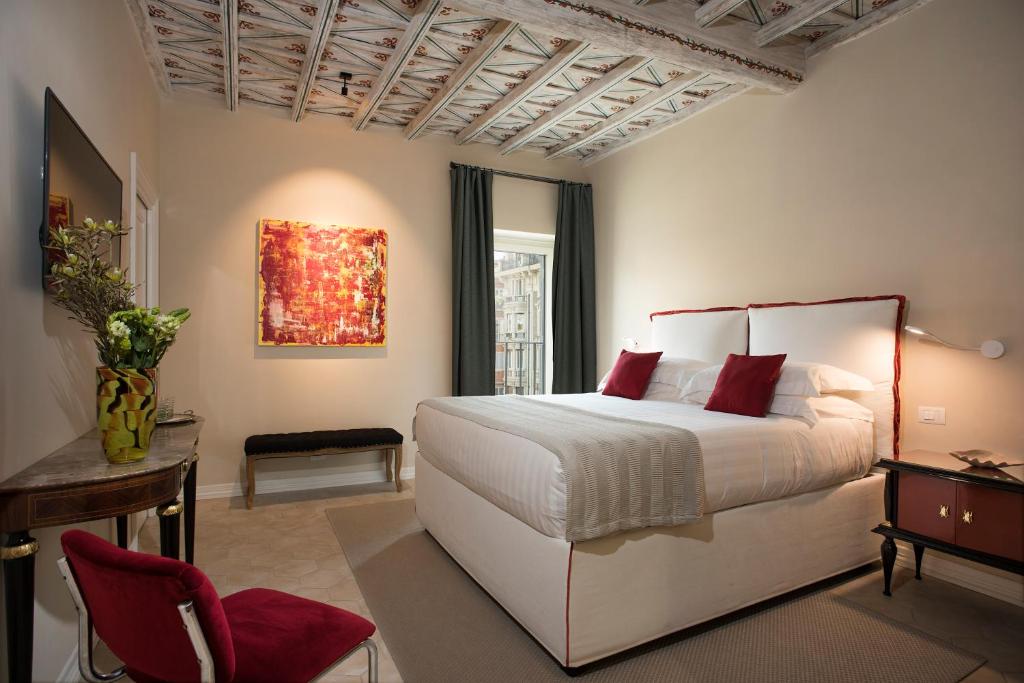 Postel nebo postele na pokoji v ubytování Palazzo Caruso